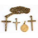 A 9ct yellow gold crucifix pendant and chain together with three further 9ct gold religious