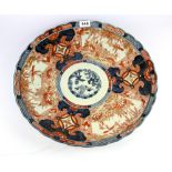 An early 19th century Japanese Imari porcelain charger, Dia. 46cm.