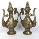 A pair of Chinese silvered bronze wine ewers, H. 31cm.