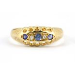 An 18ct yellow gold sapphire and diamond set ring, (N.5).