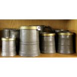 A quantity of early pewter tankards.