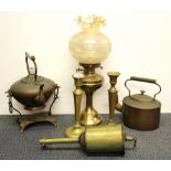 An early oil lamp, brass samovar, hanging spit and candlesticks etc.
