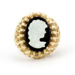 A 14ct yellow gold (stamped 14k) onyx and mother of pearl cameo ring, (L).