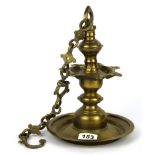 A Nepalese brass hanging oil lamp, overall H. with chain 63cm.