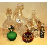 Eight contemporary glass perfume bottles and a glass pot and cover.