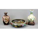 A Chinese cloisonne on copper vase on a carved wooden base, together with a cloisonne on copper bowl