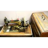 An early cased Frister and Rossmann sewing machine.