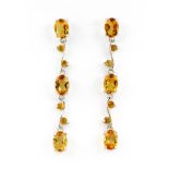 A pair of 925 silver drop earrings set with oval cut citrines, L. 4.8cm.