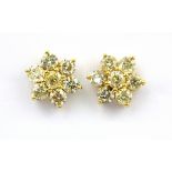 A pair of 14ct yellow gold flower shaped stud earrings set with fancy yellow diamonds, approx. 4.5ct