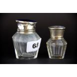 Two hallmarked silver topped and cut glass perfume bottles, tallest H. 7.5cm. (one A/F)