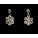 A pair of 18ct white gold (stamped 750) flower shaped drop earrings set with brilliant cut diamonds,