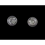 A pair of 18ct white gold diamond set stud earrings (approximately 0.50ct overall).