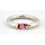 A white metal (tested silver and gold) tourmaline set ring, (N).