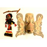 A Indonesian hand painted wooden Garuda mask and a double headed Indonesian puppet, mask H. 38cm.