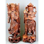 Two Chinese carved hardwood figures of guardian deities, H. 41.5cm. (A/F to one hand)