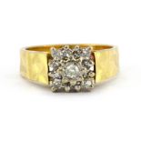 An 18ct yellow and white gold diamond set cluster ring, (M).