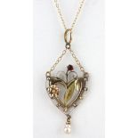 A boxed 9ct yellow gold pendant and chain set with garnet and pearl.