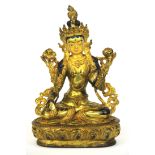A Tibetan gilt bronze painted figure of a seated Tara, H. 21cm.