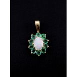 A 9ct yellow gold emerald and opal set cluster pendant, L. 2cm.