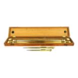 A cased navigator's brass rolling ruler and two compasses, case size 48 x 8cm.