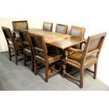 A refectory style oak draw leaf dining table and eight chairs, closed L. 122cm extends to 197cm.