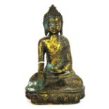 A Chinese gilt bronze figure of the seated Buddha, H. 23cm.