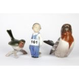 Two Royal Copenhagen porcelain figures and a further porcelain bird figure, tallest H. 11cm.