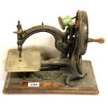 An early Victorian sewing machine by Willcox & Gibbs, W. 32cm.