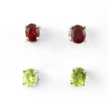 A pair of 925 silver ruby set stud earrings together with a further pair of 925 silver peridot set