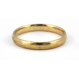 A 9ct yellow gold wedding band, (P).