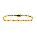 A 14ct yellow gold (stamped 14k) tennis bracelet set with brilliant cut diamonds, approx. 5.8ct