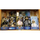 Seven boxed Meercat toys.