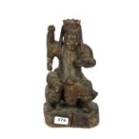 A 19th Century Chinese painted carved wooden figure of the lucky God, H. 30cm.