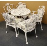 A painted metal garden table and five chairs.