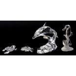 Four boxed Swarovski crystal figures of a dolphin, seahorse, seal and crab, tallest H. 10cm.