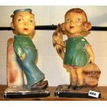 A pair of amusing 1920's chalk figures, H. 36cm.