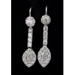 A pair of white metal (tested 18ct gold) drop earrings set with marquise cut diamonds surrounded
