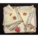 Two large embroidered table cloths and matching napkins.