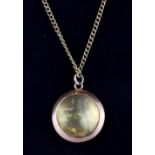 A 9ct yellow gold pendant and chain, L. 3cm.