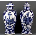 A pair of 19th Century Chinese hand painted porcelain vases and covers, H. 36cm.