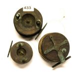 Three vintage fishing reels.