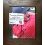 Autograph Interest. A framed autograph photograph of Tiger Woods, framed size 36 x 40cm.