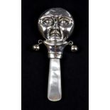 A 925 silver and mother of pearl man in the moon baby rattle.