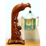 A carved wooden Chinese table lamp and pagoda shade, H. 48cm.