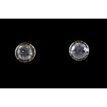 A boxed pair of 18ct yellow gold diamond set stud earrings, (approx. 0.20ct).