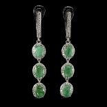 A pair of 925 silver drop earrings set with three oval cut emeralds surrounded by white stones, L.