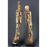 A pair of Chinese hand carved bone figures, H. 34cm.