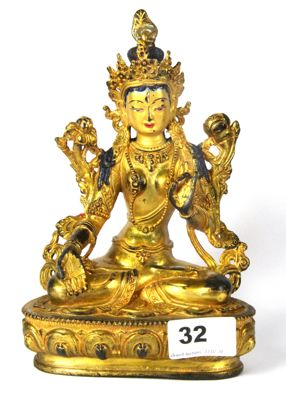 A Tibetan gilt and hand painted bronze figure of a seated Tara, H. 21cm.