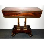 A very fine Regency gilt and brass inlaid, rosewood veneered, double pedestal folding card table, 92