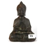 A Chinese cast iron figure of the seated Buddha holding a pagoda, H. 19cm.